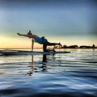 SUP Yoga at Sunset, Beautiful way to calm the mind, challenge the body, and experience nature.