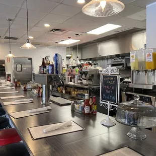 Bar seating and kitchen.