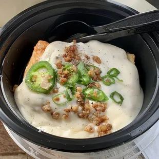 Jalapeño cheddar biscuit topped with sausage gravy, chives and fresh jalapeño slices