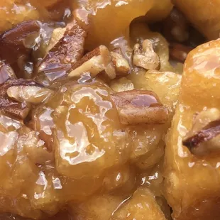 Oh my! Monkey bread, a pull apart masterpiece of croissant dough rolled in sugar and spices and topped with chopped pecans. Oh My!