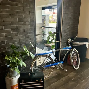 a bicycle parked in front of a window