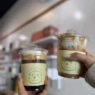 Left: iced americano with earl grey foam Right: einspanner with earl grey foam subbed
