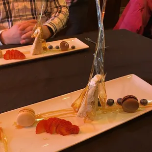 Dessert: a banana cake, hand made sugar pieces he made at the plating area, berries, macarons