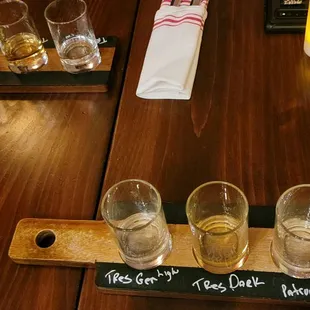 a flight of glasses on a table