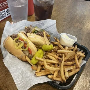 Ribeye Philly Cheesesteak with all grilled veggies and no mushrooms, side of Fresh Cut Fries. Made fresh and served hot!