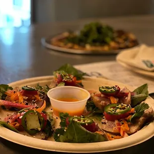 a plate of salad with dressing