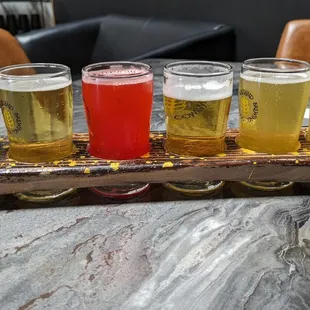 Awesome beer flight of various West Coast and hazy IPAs along with a bomb kettle fruited sour