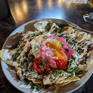 Brunch menu item: chilaquiles.  The pizza peel makes some of the best food in town.