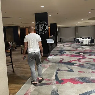 a man walking through a restaurant