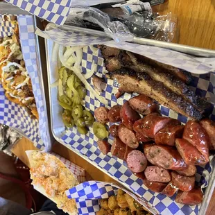 Sausage! Brisket! Potato salad! Potato wedges with brisket!
