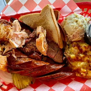1/2 lb. Brisket, 1/4 lb. chicken, 1/4 lb. sausage, potato salad (small), brisket Mac &amp; cheese (small)