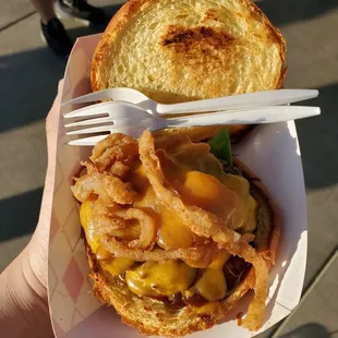 Bacon Cheddar Burger ($10), although I'm dubious that the bacon made it. Forks for scale.