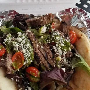 Black and blue.  Steak, gargonzola, mixed greens, tomato and chimmichur sauce.....delicious.