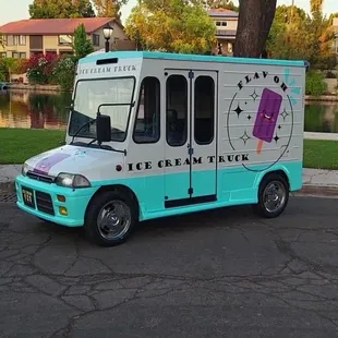 a ice cream truck parked on the side of the road