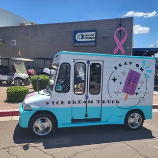ice cream truck with pink ribbon