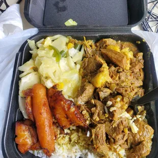 Curry goat and white rice (comes with plantain, cabbage, and festival)