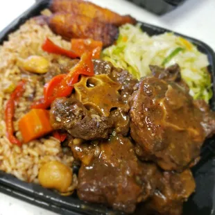 Oxtails...stream cabbage...red beans and rice...fried plantains...absolutely yummilicious