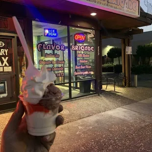 Outside of flavor brigade , Reese&apos;s pieces ice cream on bottom Cherry Italian ice and rocky road on top with some soft serve to top it off !
