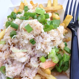 Crab garlic fries.  $13.  Shoestring fries covered in old bay sherry sauce topped with crab meat and green onions.