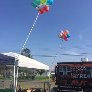 a food truck and balloons