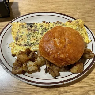 Bacon &amp; cheese omelette with house potatoes and a "biscuit"