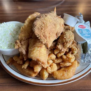 Captain's Platter (popcorn shrimp, flounder filet, oysters, deviled crab, hush puppies, baked potato, coleslaw)