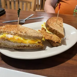 Breakfast sandwich on toast: egg, cheese, fried pork chop