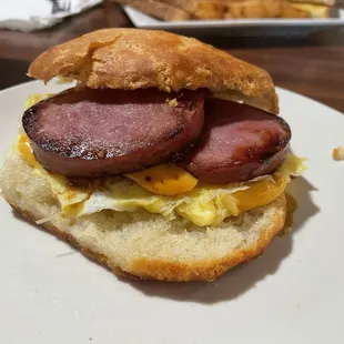 Breakfast sandwich (biscuit, Canadian bacon, egg &amp; cheese)