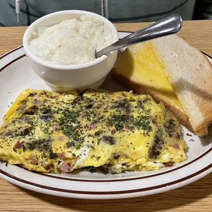 3 meat omelette with grits and white buttered toast