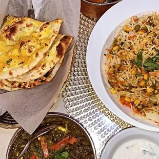 Garlic Naan, veggie rice, cheese cube and spinach, chicken and potato