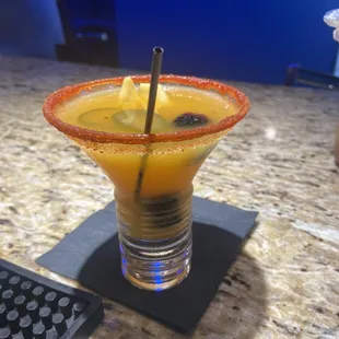 a drink in a glass with a straw