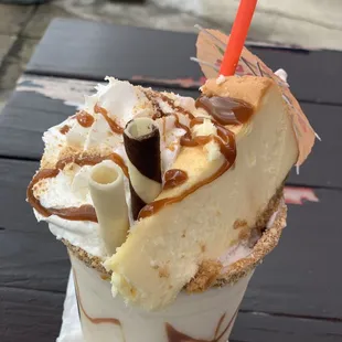 A whole slice of cheesecake in my drink