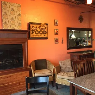 a dining area with a fireplace