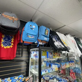 a variety of backpacks on display in a store