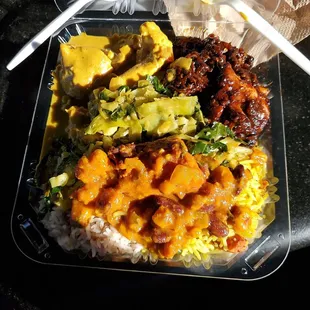 Big plate, spicy jerk chicken,  chicken curry, greens corn &amp; beans on mixed rice (Saffron and coconut rice).