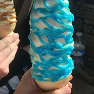 a person holding an ice cream cone