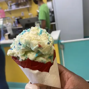 Birthday cake in a red velvet cone soooo rich and smooth