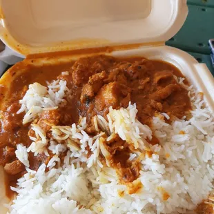 chicken curry and rice in a styrofoam container