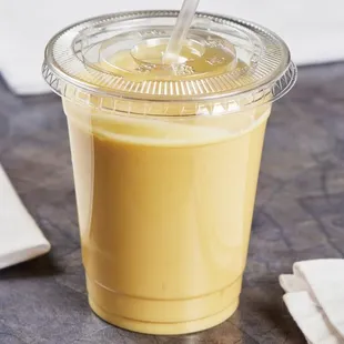 a smoothie in a plastic cup