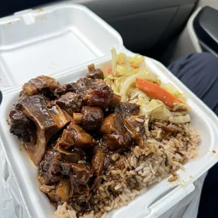 Oxtail, rice and peas and cabaggge