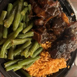 Wow this is amazing!!! Oxtails, green beans, and joloft rice.