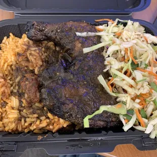 They serve out of UofM University Hospital! My lunch on repeat: Jerk chicken thigh and leg with jollof rice (spicy!!) and slaw.