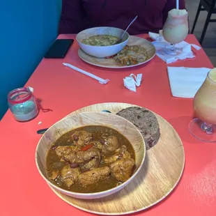 a bowl of stew and a plate of rice