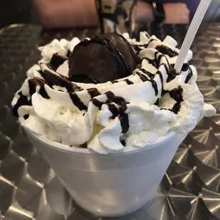 Oreo Overload. Vanilla ice cream with Oreo pieces throughout and chocolate. Topped with a large Oreo ball! Big enough to split! $7