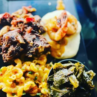 The collards were savory. The Mac and cheese was thick .