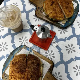 two sandwiches on cutting boards