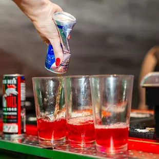 a bartender pouring a drink