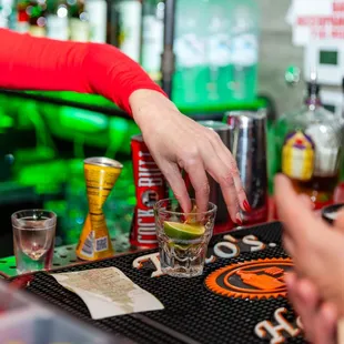 a bartender pouring a drink