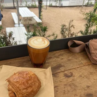 Chocolate croissant, oat milk latte.