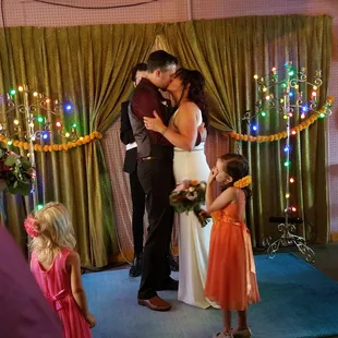 a bride and groom sharing a kiss